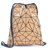 A geometric patterned cork backpack with a light brown color and black drawstring closure.