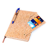 cork notebook showing card and pen holder